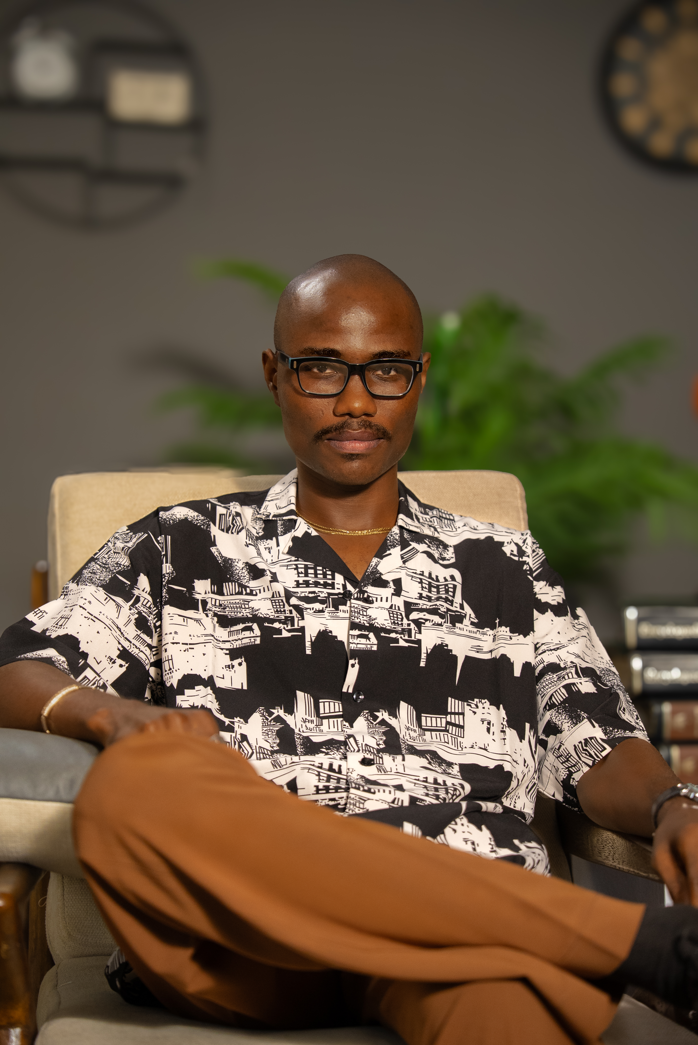 Umoh Etido seated in a studio portrait