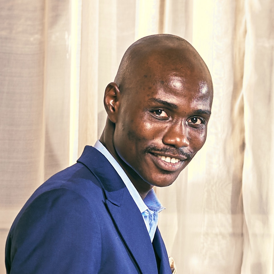 Umoh Etido in a blue suit